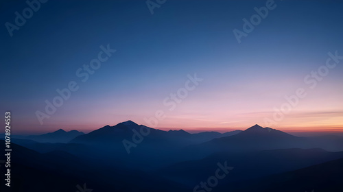 Silhouetted Mountain Ranges at Sunset, with a Stunning Pink and Blue Gradient Sky