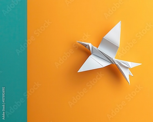 Origami bird in progress with stepbystep instructions displayed, bird origami folding, visual folding guide photo