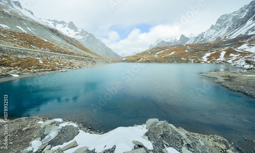 The autumn snowscape on the mountaintop of Haxilegen Mountain along Duku Highway on the Pamir Plateau in Akto County, Xinjiang, China during September photo