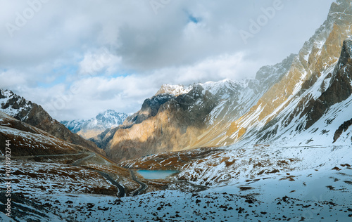The autumn snowscape on the mountaintop of Haxilegen Mountain along Duku Highway on the Pamir Plateau in Akto County, Xinjiang, China during September photo
