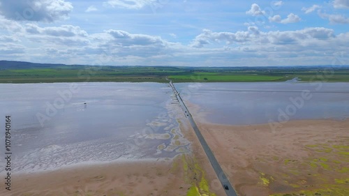 Lindisfarne, Northumberland, UK, June 19, 2024; aerial clip of Lindisfarne Causeway, Holy Island, Northumberland, England, UK. photo