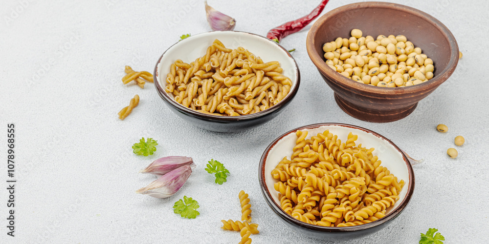 Pasta. Various kinds of uncooked pasta and noodles over light stone background. Traditional Italian Pasta. Various kinds of uncooked pasta and noodles over light stone background. Traditional Italian