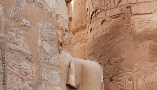 Part of damaged statue and walls at Karnak temple in Luxor, Egypt photo