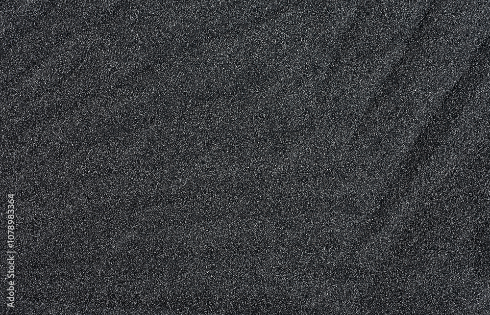 Pile of black quartz sand as background, top view. Crushed quartz. Pile of black quartz sand as background, top view. Crushed quartz.