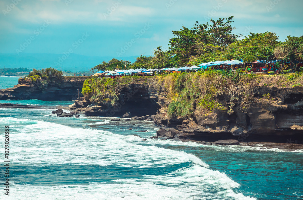 Beautiful Uluwatu coast with rocks and ocean waves, Bali, Indonesia