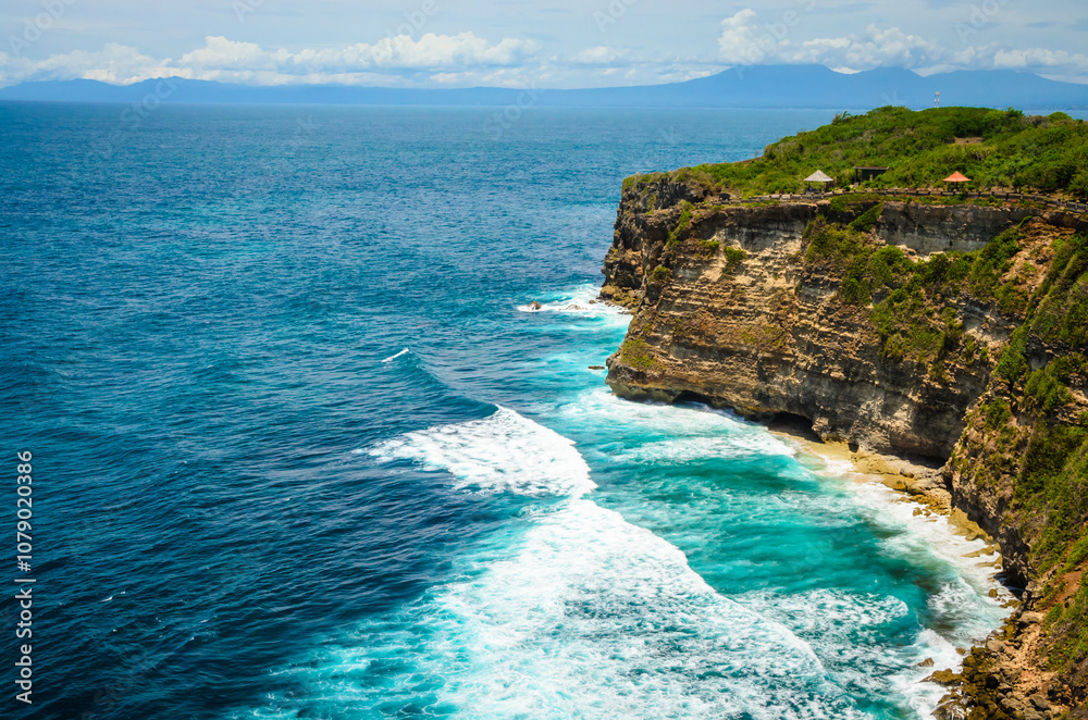 Beautiful Uluwatu coast with rocks and ocean waves, Bali, Indonesia