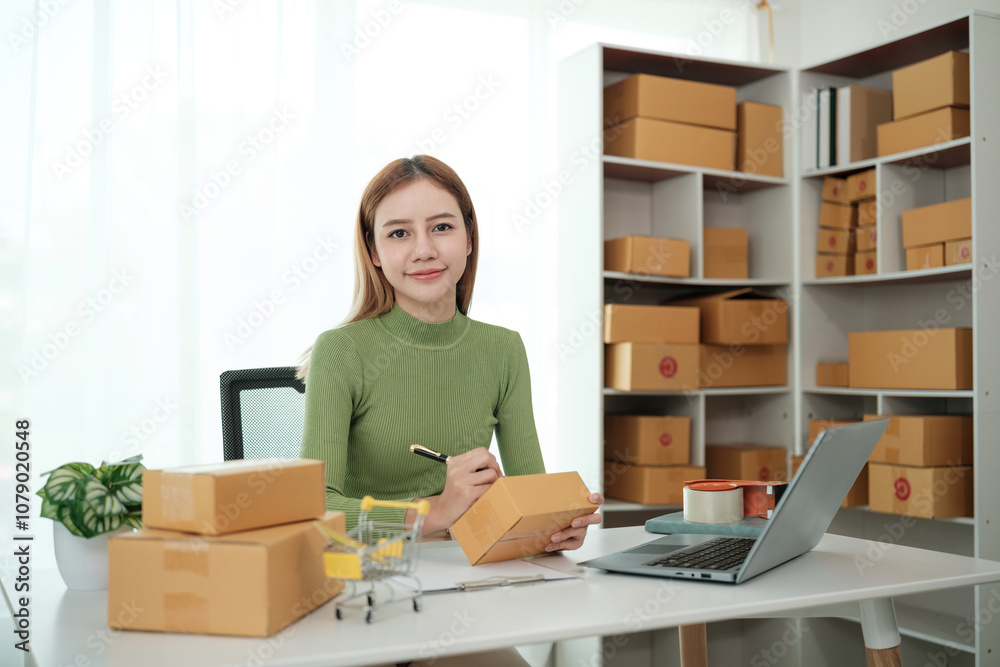 A woman is sitting at a desk with a laptop and a stack of boxes A woman is sitting at a desk with a laptop and a stack of boxes