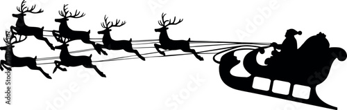 Silhouette of Santa flying on a sleigh pulled by reindeer