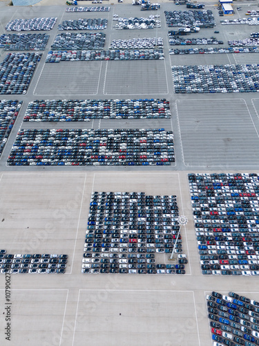Wallpaper Mural New Cars on Large Half Empty Parking Lot in Port Ready for Distribution. Harbor Car Storage for Export and Import. Automotive Industry Business. Setubal, Portugal. Aerial View Torontodigital.ca