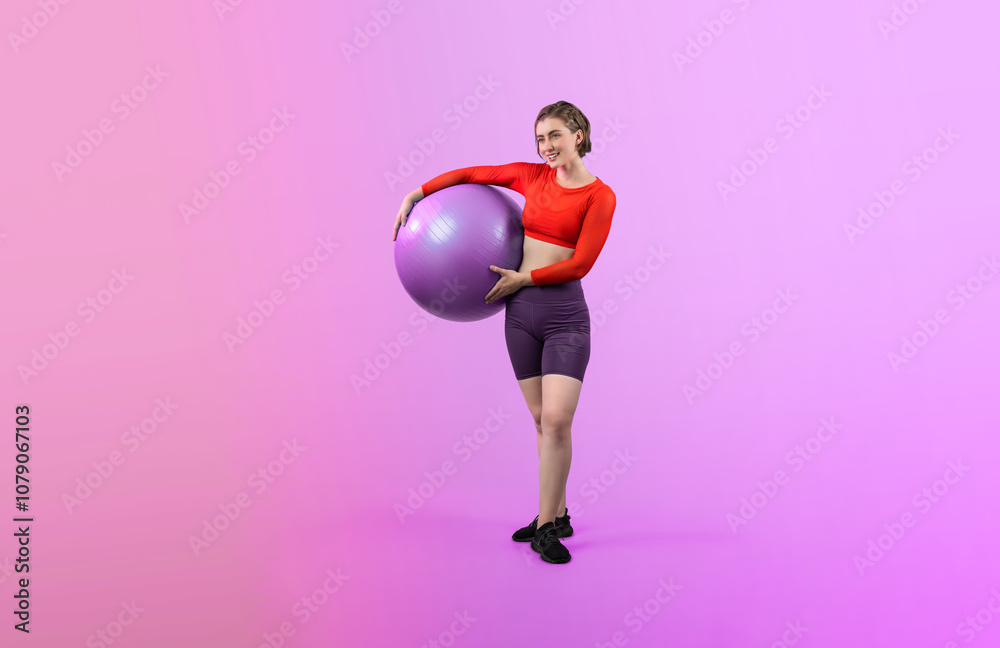 Full body length gaiety shot athletic and sporty young woman with fitness exercising ball in standing posture on isolated background. Healthy active and body care lifestyle. Full body length gaiety shot athletic and sporty young woman with fitness exercising ball in standing posture on isolated background. Healthy active and body care lifestyle.
