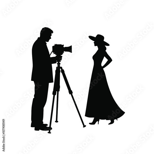 A silhouette of a cameraman operating a standing camera on a tripod,