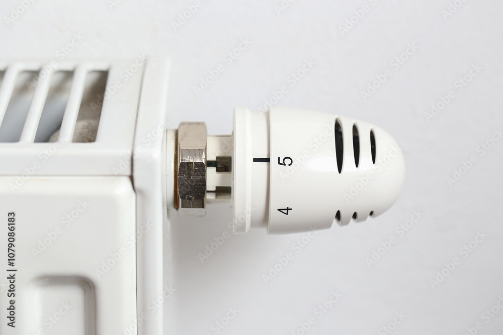Thermostat set to five. Cold weather heating control. Radiator background for winter season and home heating costs. House radiator background. Full power interior convector. Thermostat set to five. Cold weather heating control. Radiator background for winter season and home heating costs. House radiator background. Full power interior convector.