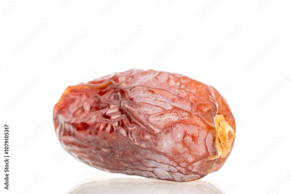 Dried sweet dates isolated on white background, close-up. Dried sweet dates isolated on white background, close-up.