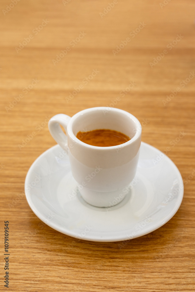 Espresso cup on a café terrace table, capturing the warmth of a quiet morning. Rich crema topping the coffee adds texture, while soft shadows evoke a relaxed outdoor ambiance. Espresso cup on a café terrace table, capturing the warmth of a quiet morning. Rich crema topping the coffee adds texture, while soft shadows evoke a relaxed outdoor ambiance.