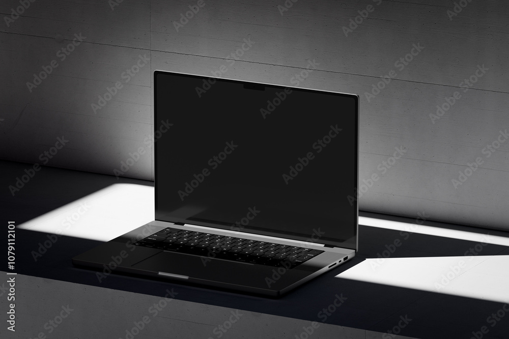 Scene with an open laptop with a blank screen on a concrete background Scene with an open laptop with a blank screen on a concrete background