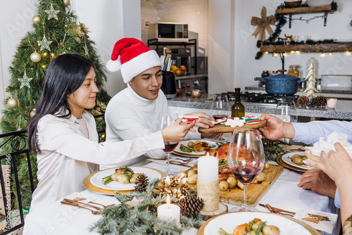 Latin Teenagers from Mexican family having Christmas dinner at home in Mexico Latin America, hispanic daughter and son on holidays 