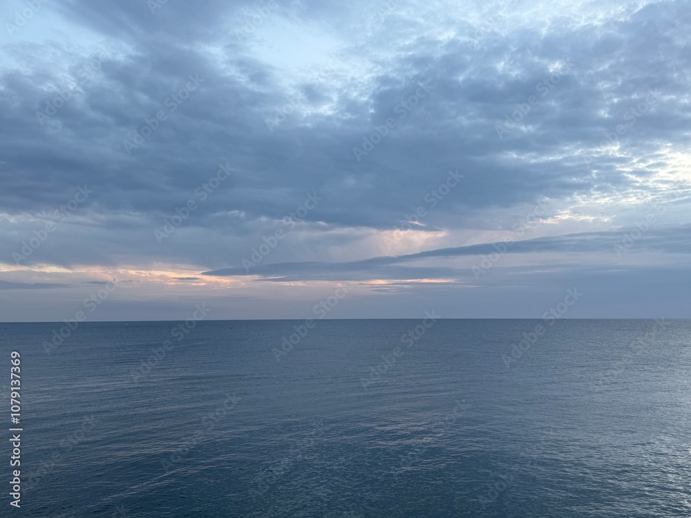 Fototapeta premium clouds over sea in the evening 