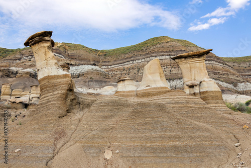 Sandstone hoodoos created by erosion in scenic badlands in summer.