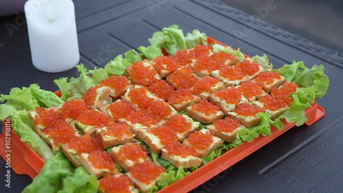 Red caviar sandwiches. An appetizer at the event. Buffet