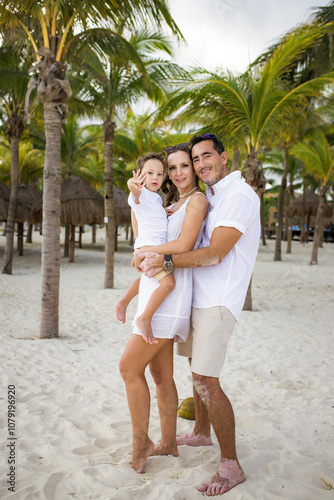 Happy family on the tropical beach. Family vacation