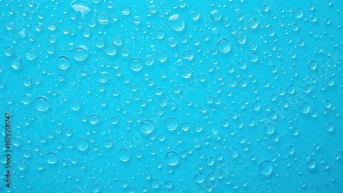 Water drops glistening on a vibrant blue background, tranquil, refreshing, shiny