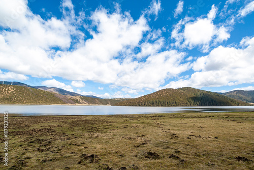 Mountain lake surrounded by trees in Potatso National Park, Shangri La, Yunnan, China, Asia photo