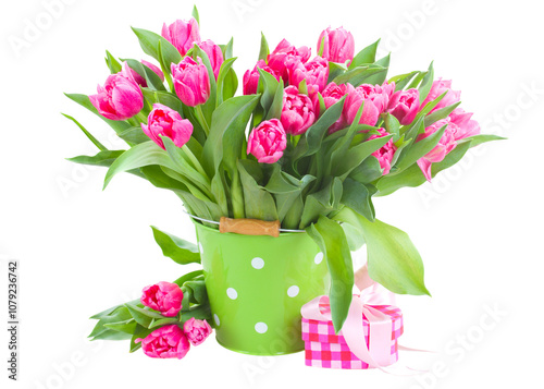 bouquet of pink tulips in green pot