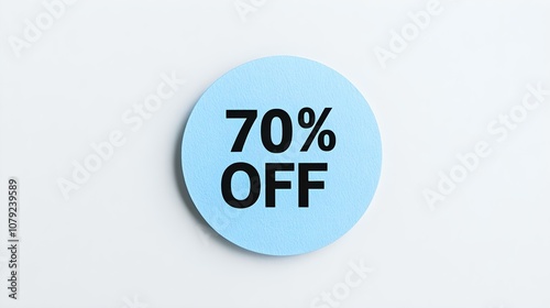 Black '70% OFF' Text on a Light Blue Round Paper Note. White Background with Copy Space