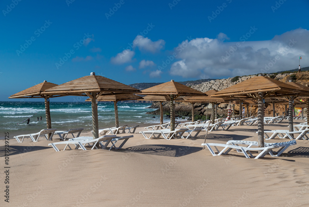 Fototapeta premium Sun loungers and umbrellas on the beach