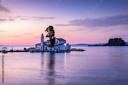 The beautiful Holy Monastery of Vlacherna at sunrise in Corfu, Greece photo