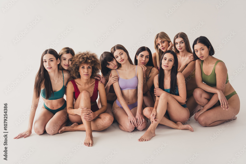 Studio full length no retouch photo seductive shiny ladies dressed lingerie enjoying self acceptance isolated beige color wall background Studio full length no retouch photo seductive shiny ladies dressed lingerie enjoying self acceptance isolated beige color wall background