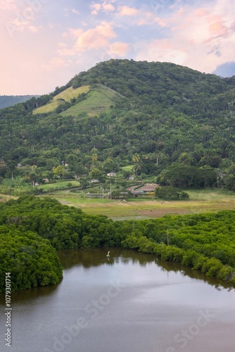 Lush Green Hill and Tranquil Lake