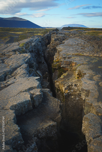 The Grjótagjá fissure near Lake Mývatn, Iceland, reveals a dramatic geological rift between tectonic plates.