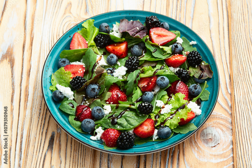 Berries salad (blueberry strawberry blackberry ) with cheese feta and balsamic sauce