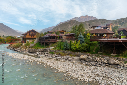 a modern recreation center on the banks of a mountain river photo