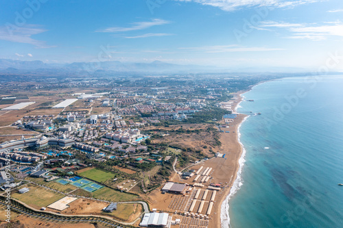 Fototapeta Naklejka Na Ścianę i Meble -  Gündoğdu holiday tourist region. Summer vacation on beach, Hotels sea, beach, coast, sports fields, water sports and sun. Drone Aerial view. Mediterranean,  Manavgat - Alanya – TURKEY