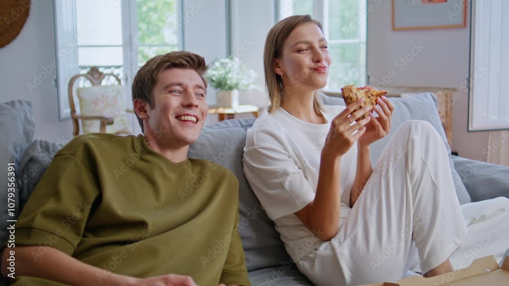 Hungry friends enjoy tv dinning at home closeup. Youngsters choosing video game Hungry friends enjoy tv dinning at home closeup. Youngsters choosing video game