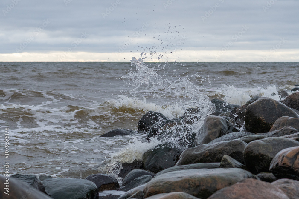 Splashes from the waves bumping against the rocky shore. Splashes from the waves bumping against the rocky shore.