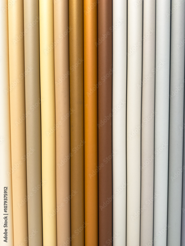 Fototapeta premium A row of colorful paper tubes, each a different color
