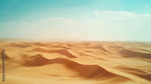 Endless golden sand dunes stretch beneath a clear blue sky, evoking a sense of surreal beauty and tranquility in a vast, arid desert landscape.