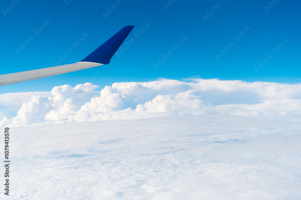 blue sky with a few clouds. The sky is very bright and the clouds are scattered throughout. Beautiful cloud in blue sky. White fluffy clouds in the sky. blue sky with a few clouds. The sky is very bright and the clouds are scattered throughout. Beautiful cloud in blue sky. White fluffy clouds in the sky.
