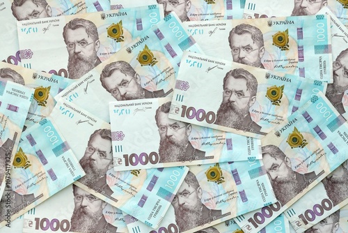 Big amount of ukrainian new one hundred hryvnia money bills with modern design. Financial concept, business