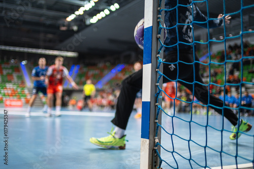 Obraz na płótnie Detail of handball goal post when the ball hits it. Handball match in the background..handball; w salonie