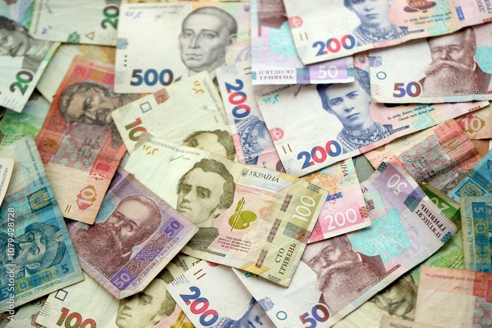 Fototapeta premium Big amount of different ukrainian hryvnia currency money bills in pile