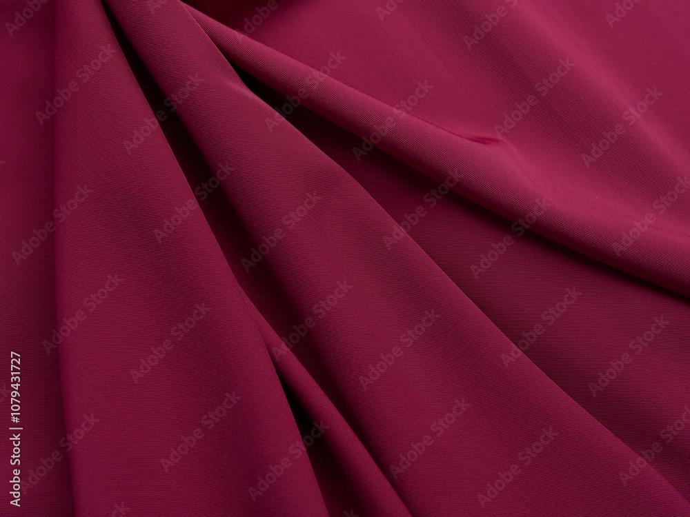 Purple fabric lies in beautiful folds. High-quality texture of purple fabric. Purple fabric lies in beautiful folds. High-quality texture of purple fabric.