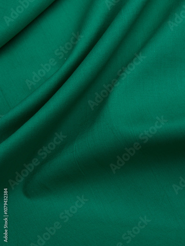 Background - new green linen fabric. High-quality texture of expensive fabric.