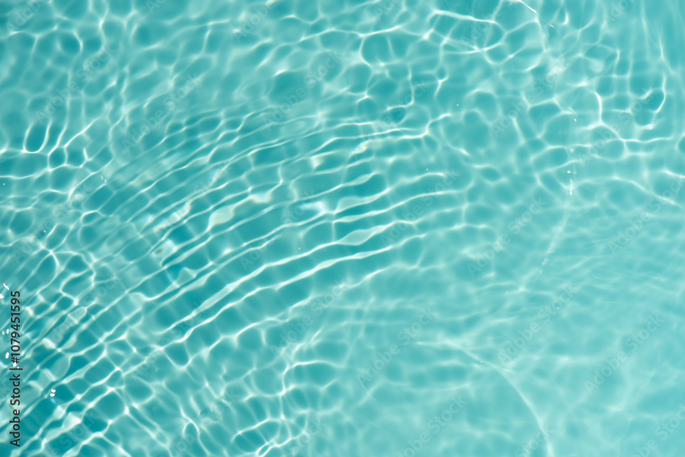 Blue water with ripples on the surface. Defocus blurred transparent blue colored clear calm water surface texture with splashes and bubbles. Water waves with shining pattern texture background. Blue water with ripples on the surface. Defocus blurred transparent blue colored clear calm water surface texture with splashes and bubbles. Water waves with shining pattern texture background.
