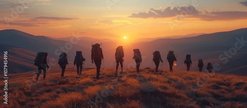 Silhouettes of Hikers at Sunset on a Mountain Ridge