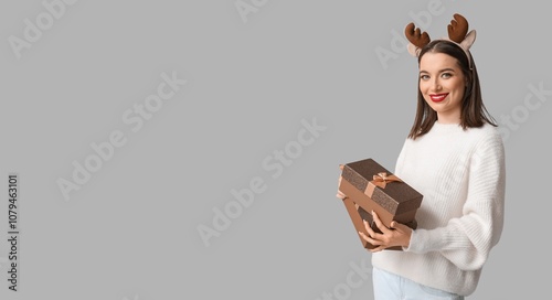 Pretty young woman holding ...