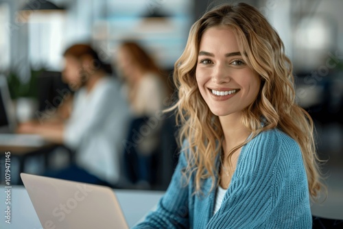 Successful businesswoman smiling at work with laptop in corporate office